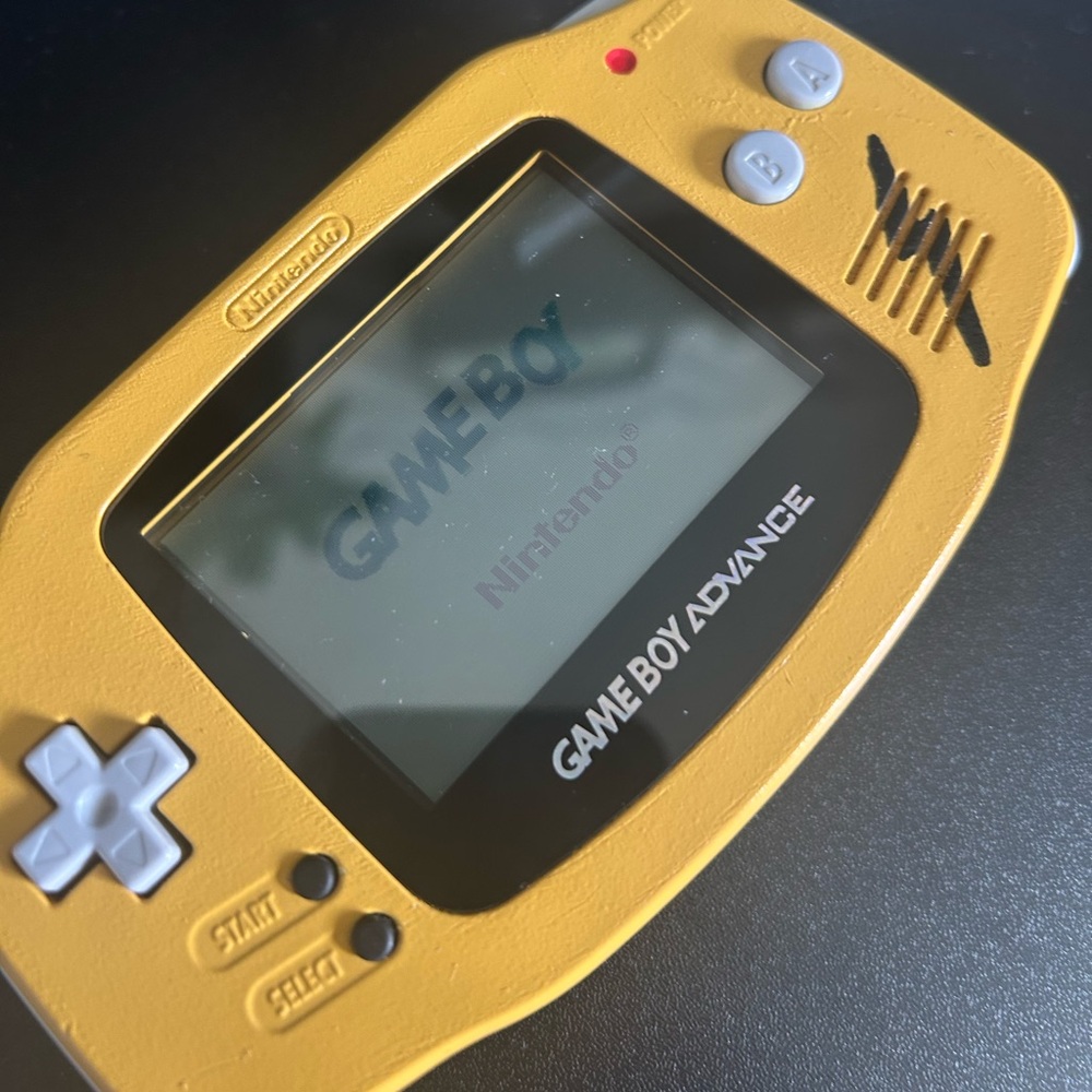 Custom (Pika) Gameboy advanced and Pokémon Red and Gold games.